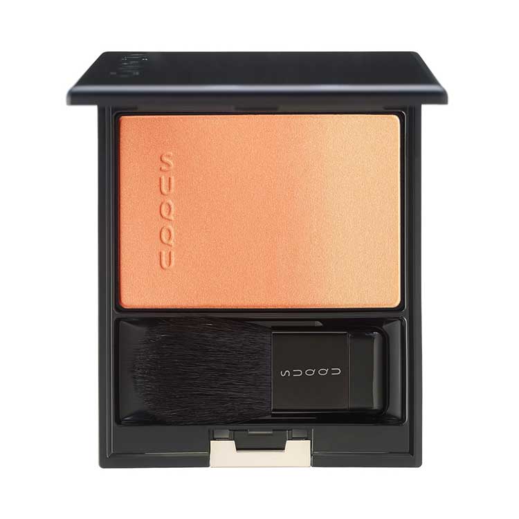 Suqqu Pure Color Blush 7.5g in orange-to-gold gradient with brush, delivering a sun-kissed, luminous finish.