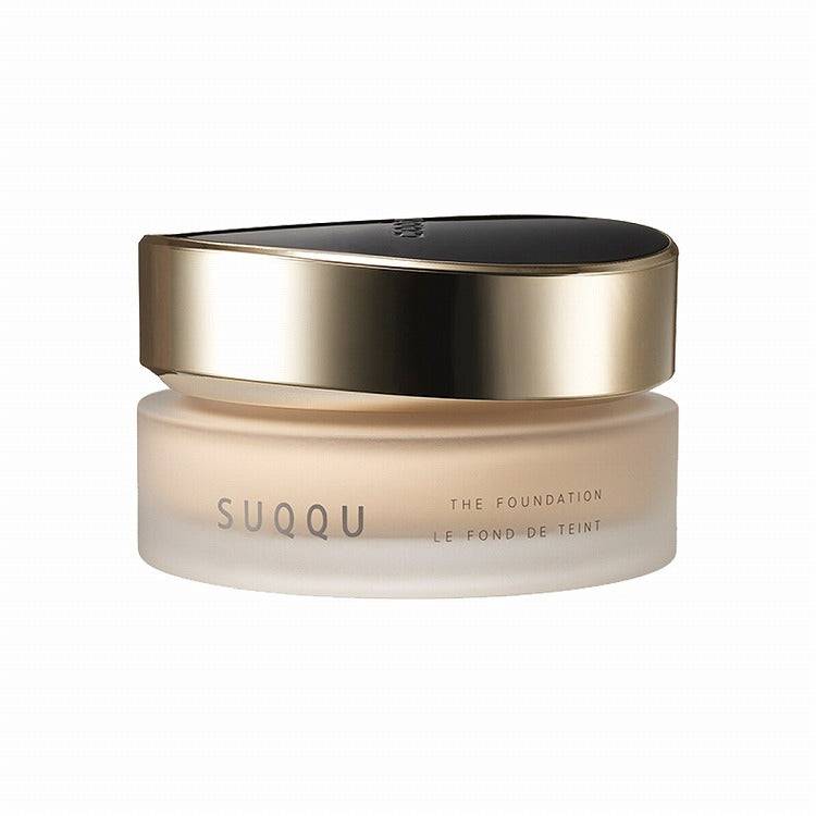 Suqqu The Foundation 30g in a frosted jar with a luxurious gold and black lid, perfect for a radiant and long-lasting finish.