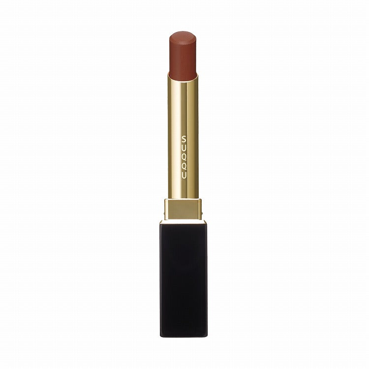 Suqqu Velvet Fit Lipstick in a chocolate brown shade with a sophisticated black and gold tube, ensuring a creamy and uniform finish.