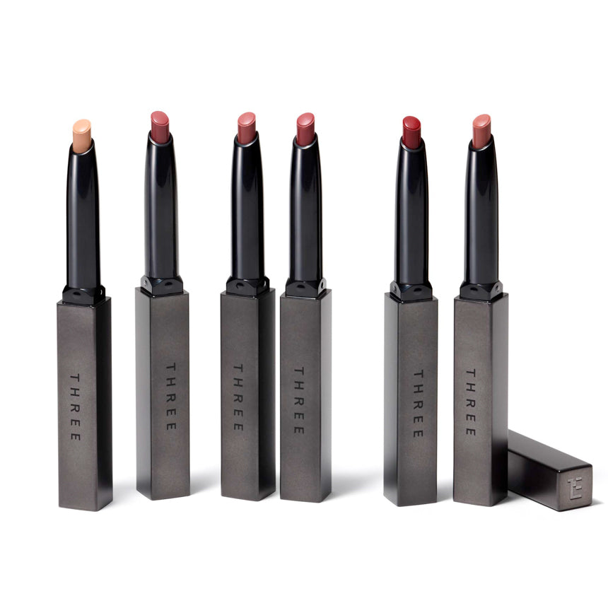 Set of six Three Dream On Alluring lil one lipsticks in sleek metallic cases, showcasing a variety of shades for versatile lip makeup.