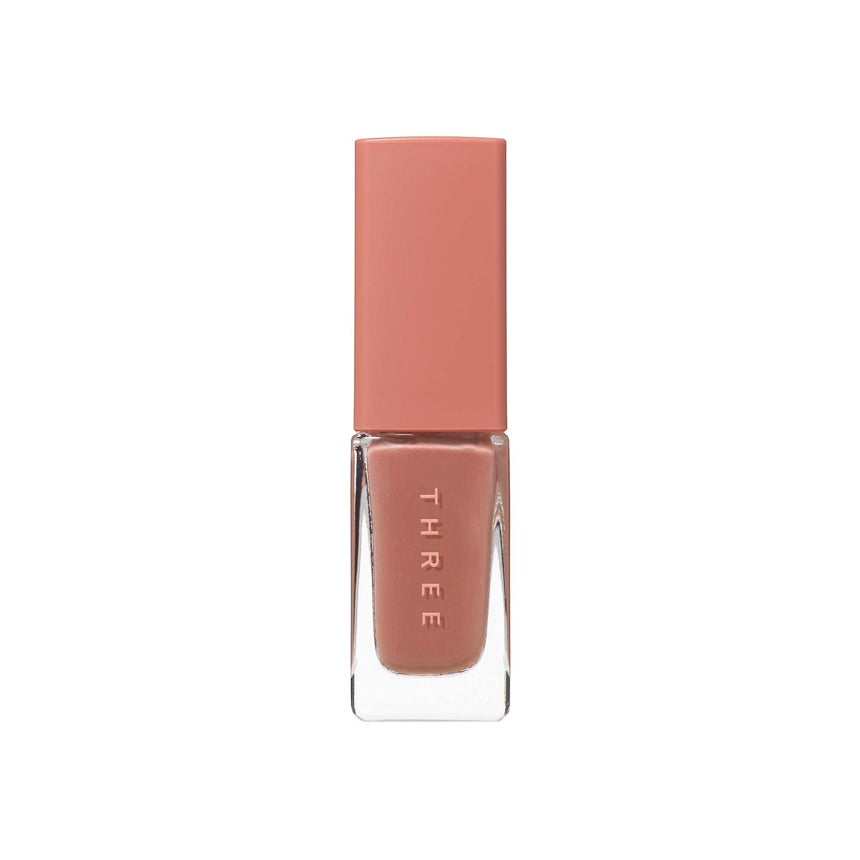 Three Nail Lacquer 7ml in warm peach shade with a peach-toned cap, ideal for soft and feminine nail looks.