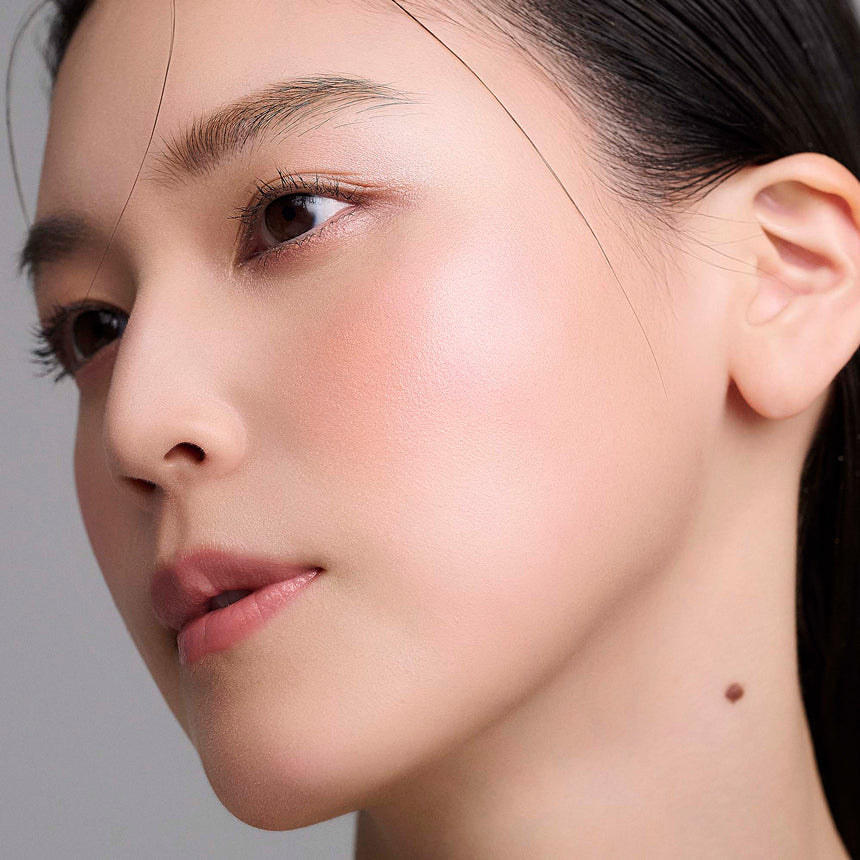 Shimmering glow THREE highlighter blush and contour palette for radiant, natural makeup look