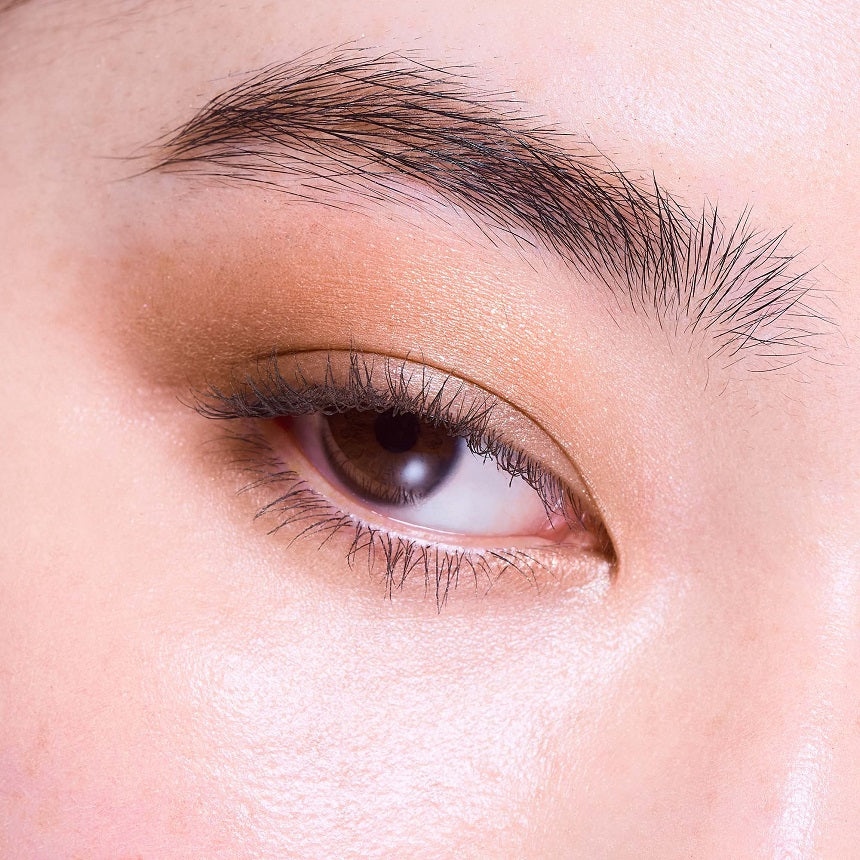 Close-up of an eye with a deep brown and rosy gradient achieved using the Three Stargazing Eye Quad for a natural look.