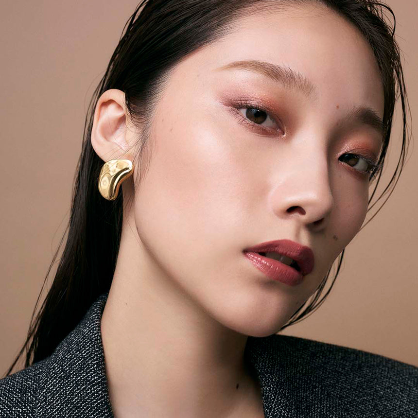 Close-up of an eye with a deep brown and rosy gradient achieved using the Three Stargazing Eye Quad for a natural look.
