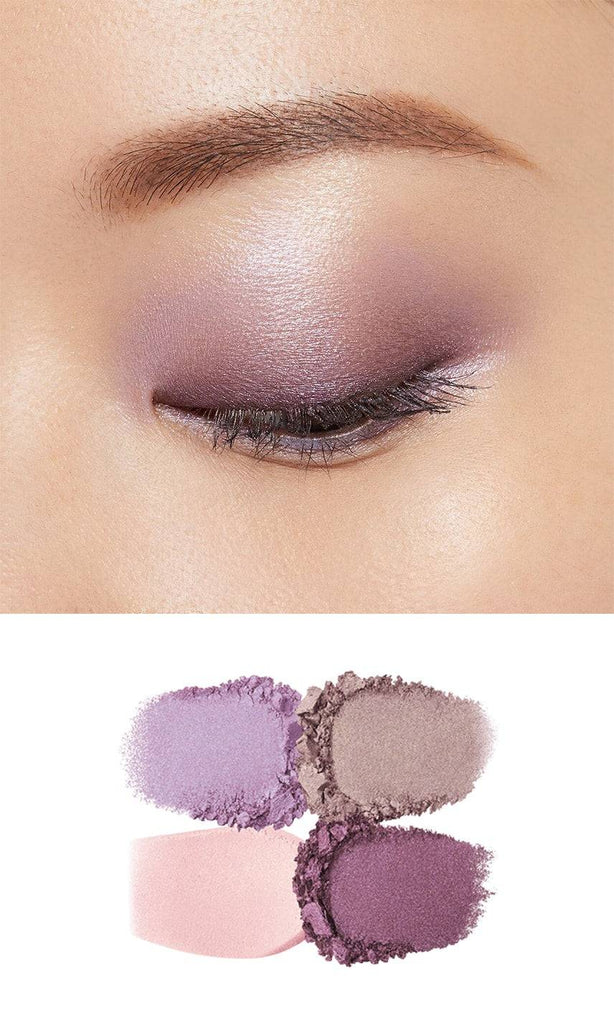 Clé de Peau Beauté Ombre Couleur Quadri eye shadow palette applied on eyelid, showcasing a soft purple gradient with shimmer.