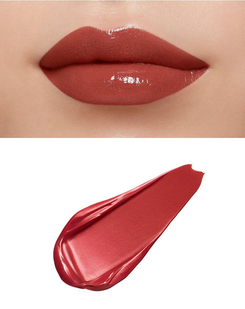 Lips with Clé de Peau Beauté Rouge Crème Briand in soft pink, displaying a glossy finish and smooth application with a pink swatch.