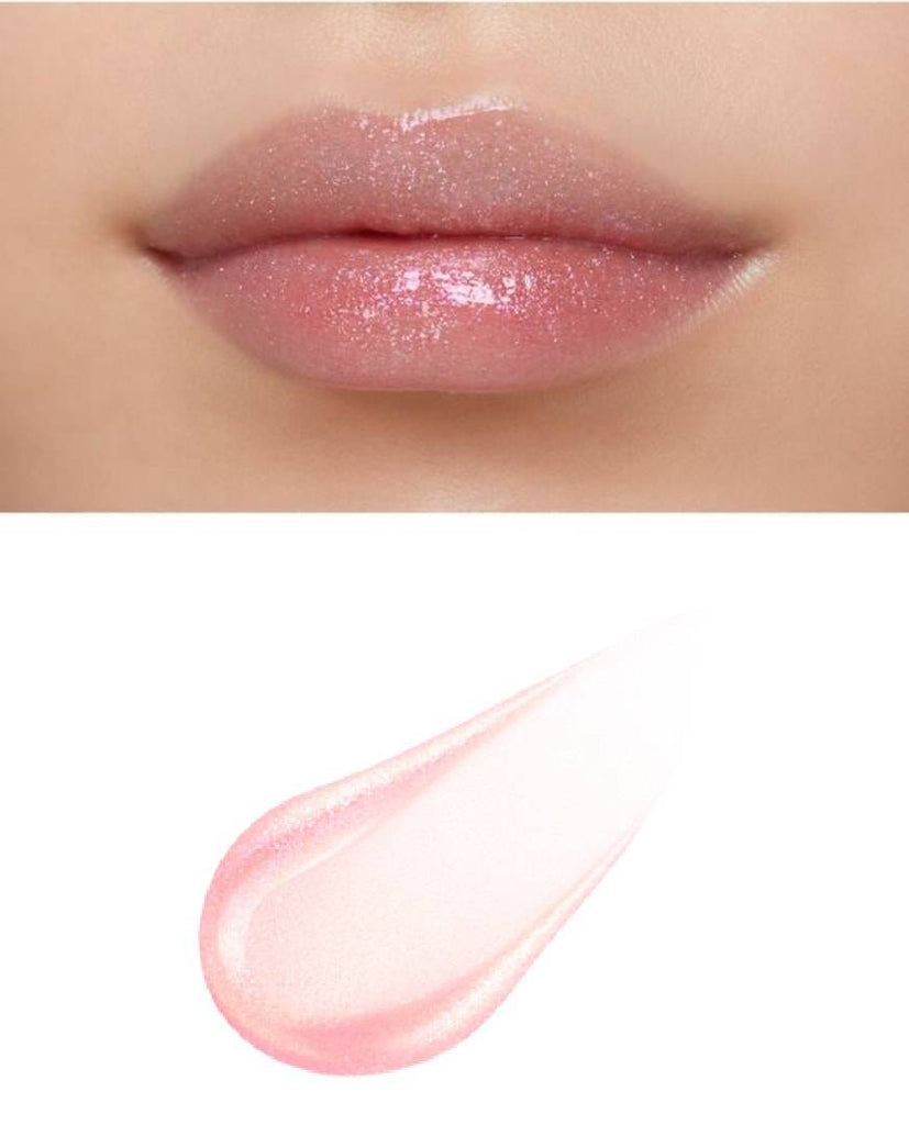 Clé de Peau Beauté Rouge Crème Etancelan lip gloss applied on lips, highlighting a glossy soft pink finish with shimmer.