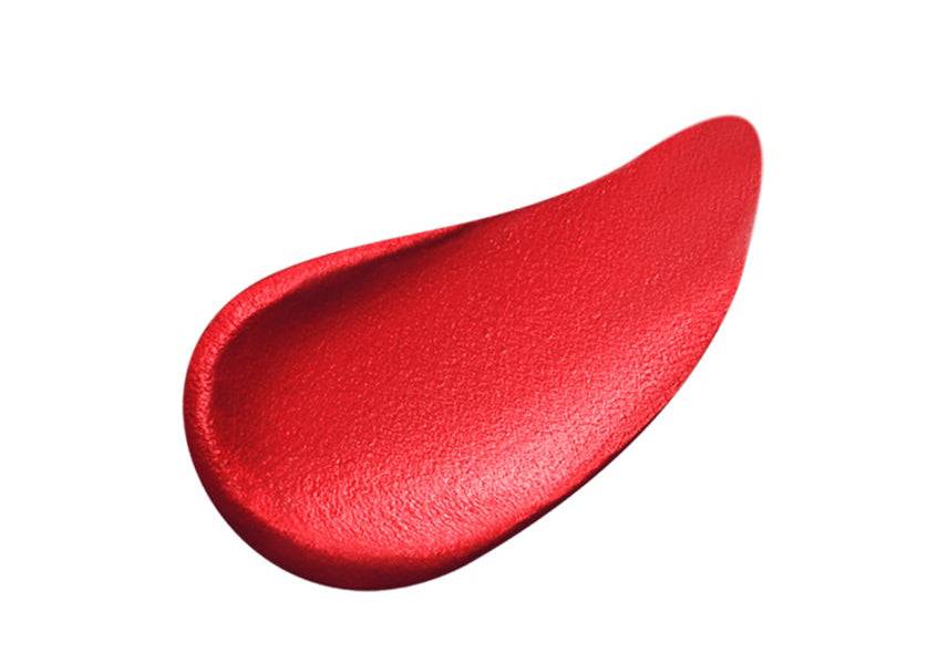 Close-up of Clé de Peau Beauté Rouge Allève Matte lipstick in a bold red shade with a smooth matte finish.