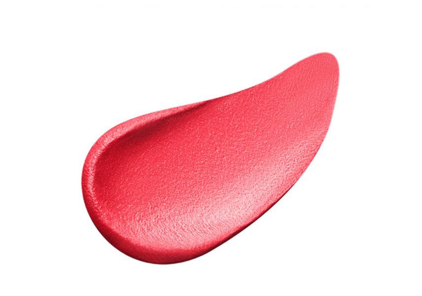 Close-up of Clé de Peau Beauté Rouge Allève Matte lipstick in a striking red-pink shade with a velvety matte texture.