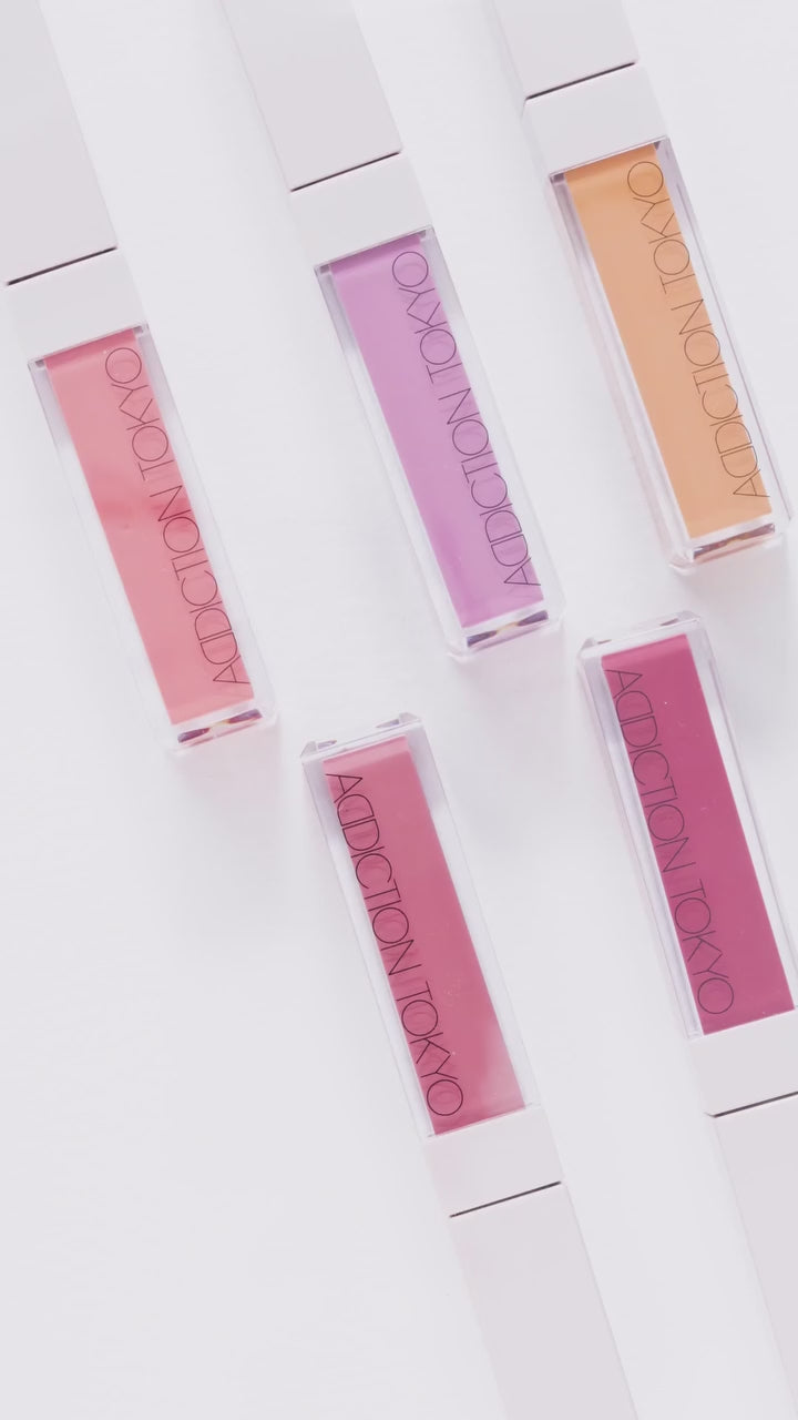 Collection of Addiction Tokyo The Liquid Blush Glow in various shades, showcasing sleek packaging and vibrant color options.