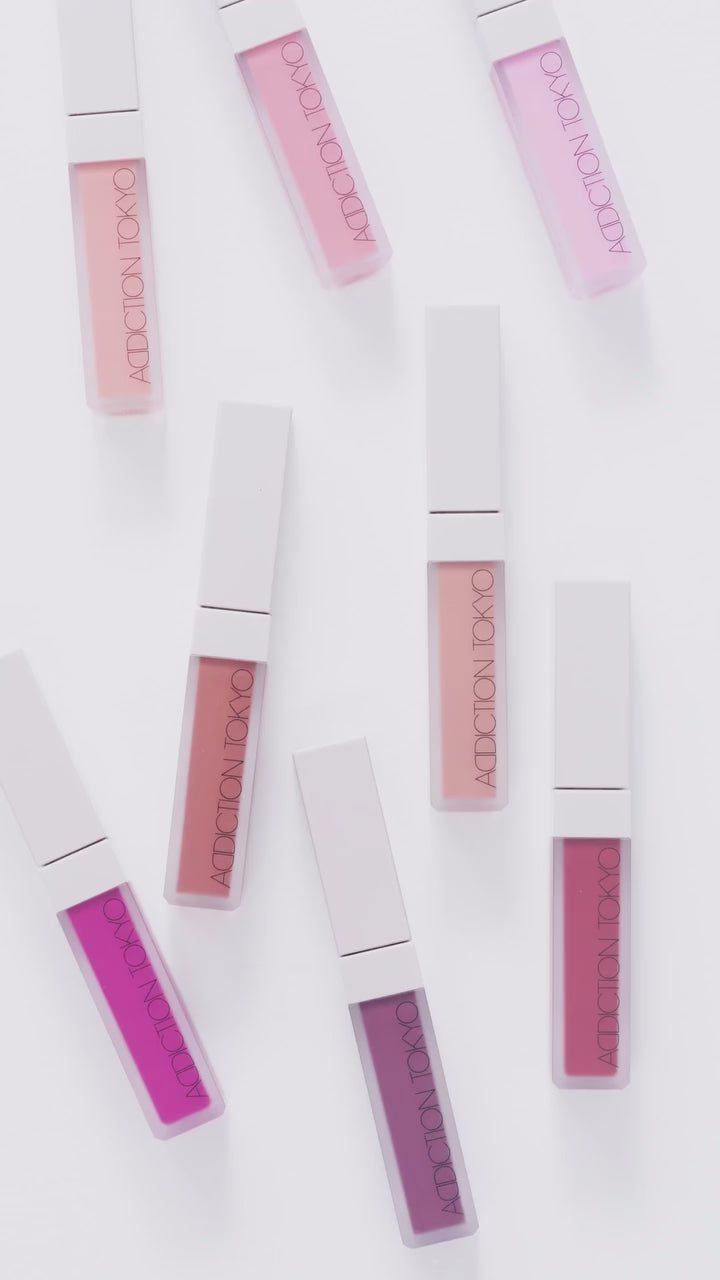 Flat lay of Addiction Tokyo The Liquid Blush Foggy in multiple shades, arranged aesthetically to highlight the product's variety.