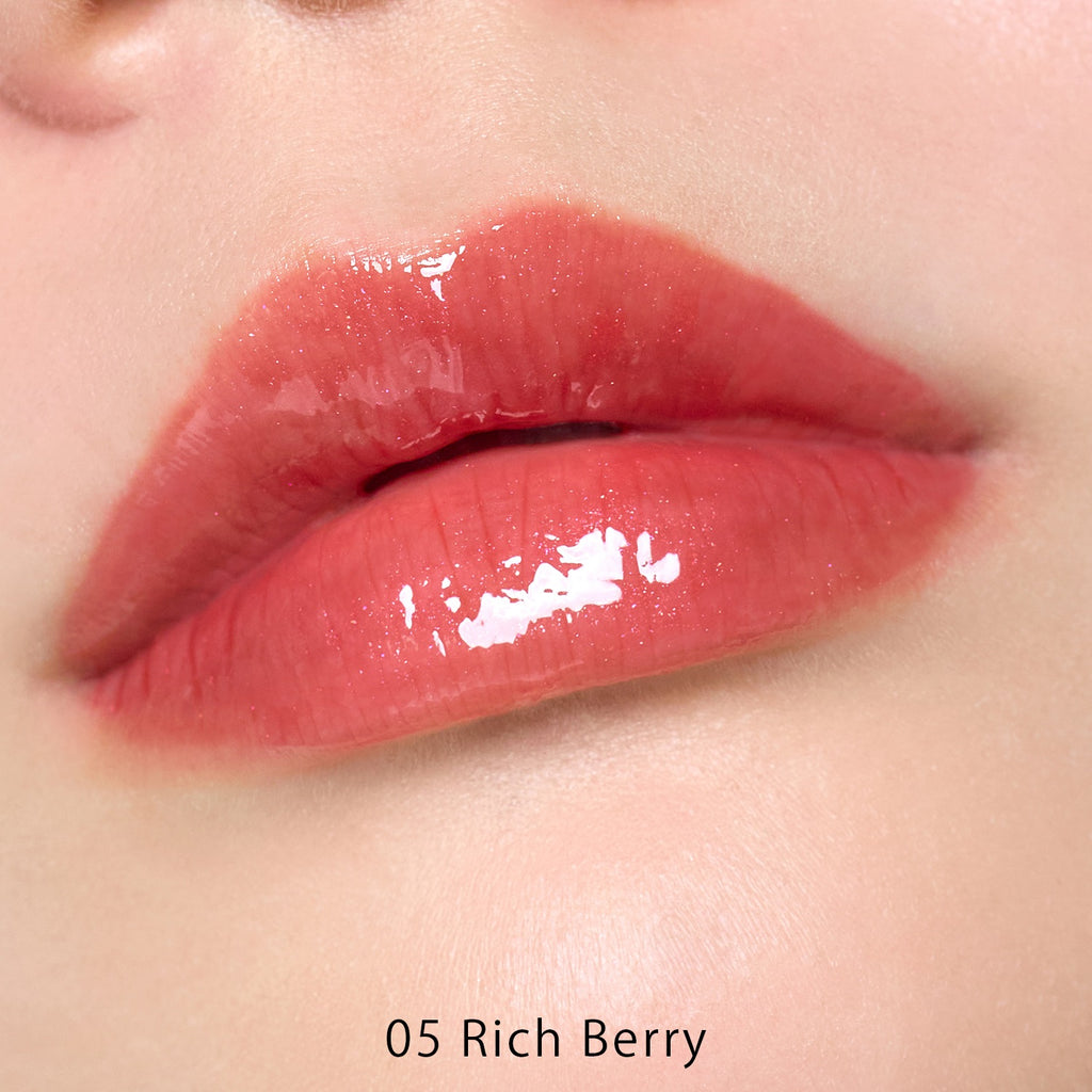Petal Blooming lip gloss by to/one showcasing vibrant, glossy lips with a smooth, floral-inspired finish