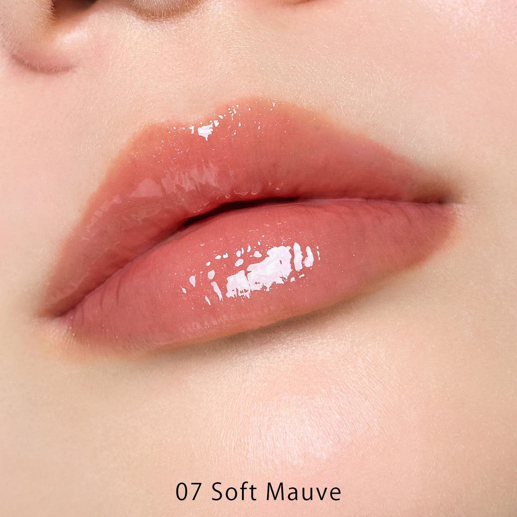 Petal Blooming lip gloss by to/one showcasing vibrant, glossy lips with a smooth, floral-inspired finish