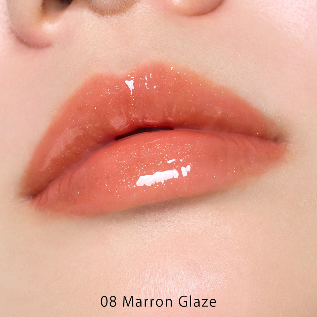 Petal Blooming lip gloss by to/one showcasing vibrant, glossy lips with a smooth, floral-inspired finish